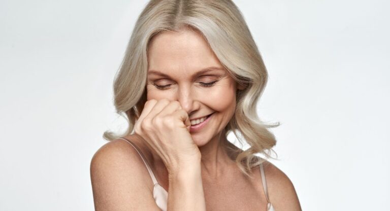 life after 50 shy woman smiling