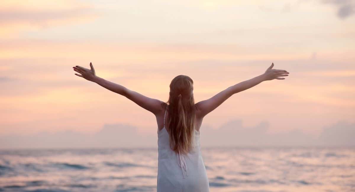 quotes about change, woman with her arms in the air