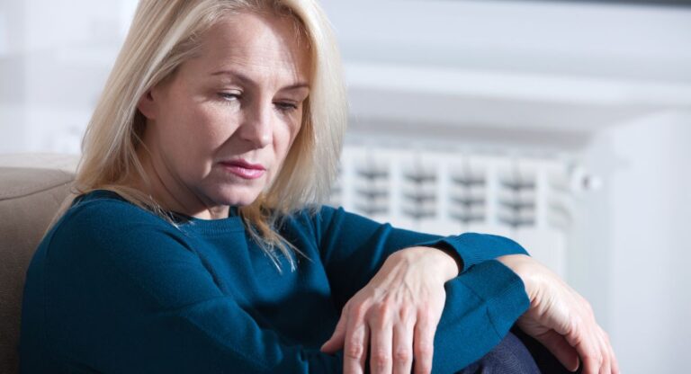 sad woman feeling worthless over 50