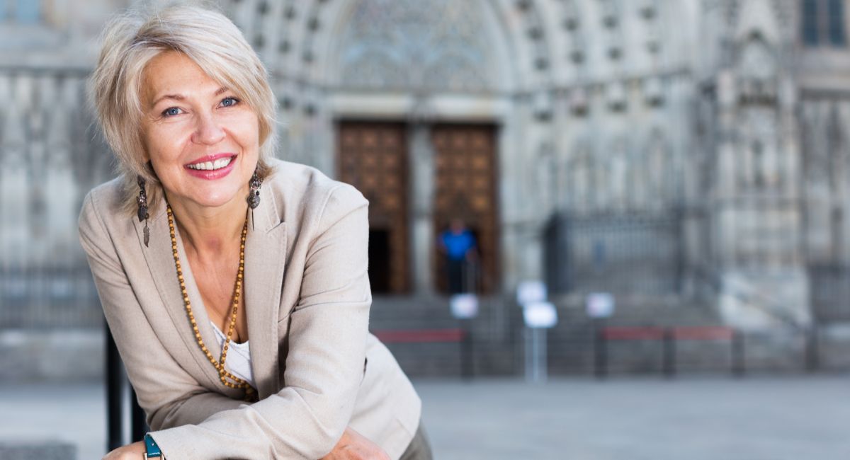 happy woman over 50 reinventing your life over 50 blog