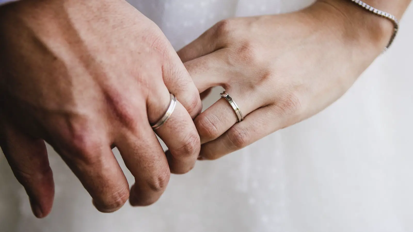 getting married at 50, couple with wedding rings