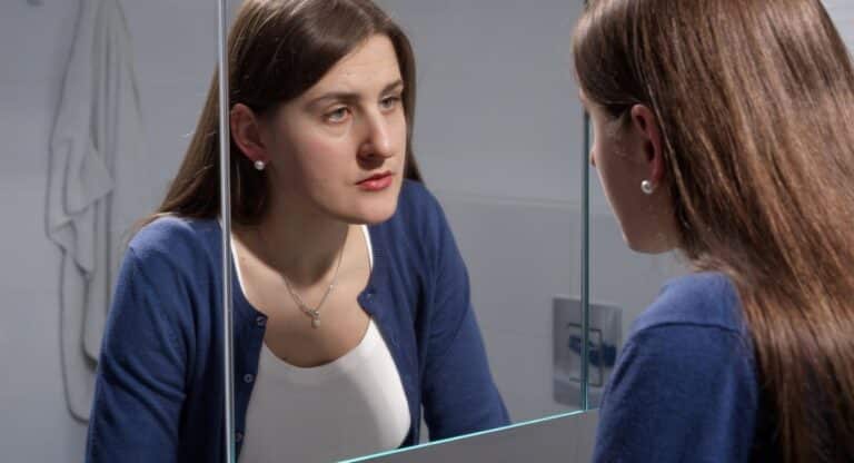 mental health activities, woman staring in mirror