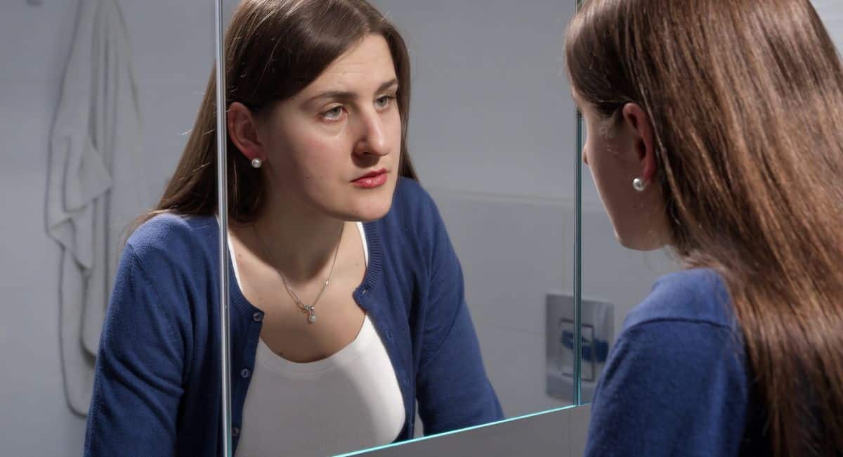 mental health activities, woman staring in mirror