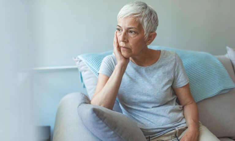 biggest regrets in life sad looking 60 year old woman
